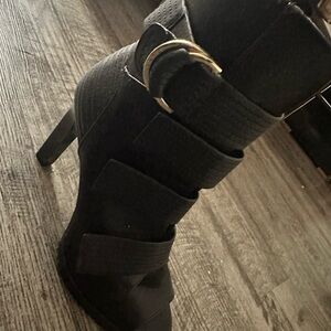 Sleek Black Heeled Boots with Straps